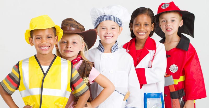 Group of children wearing outfits of common careers.
