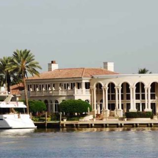Beautiful villa with yacht in front
